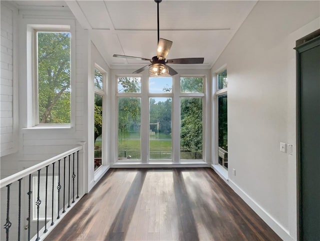 unfurnished sunroom with ceiling fan and plenty of natural light