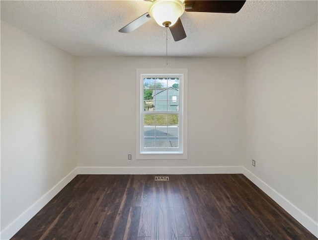 unfurnished room featuring a textured ceiling, ceiling fan, and dark hardwood / wood-style flooring