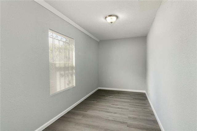 unfurnished room with hardwood / wood-style floors