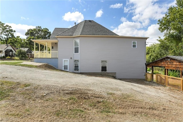 view of side of property with a carport