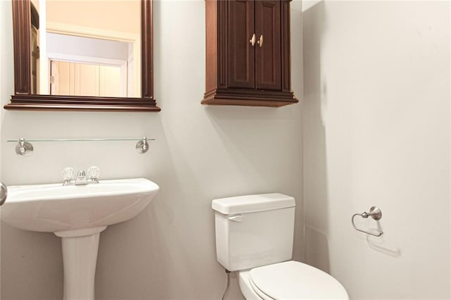 bathroom with sink and toilet