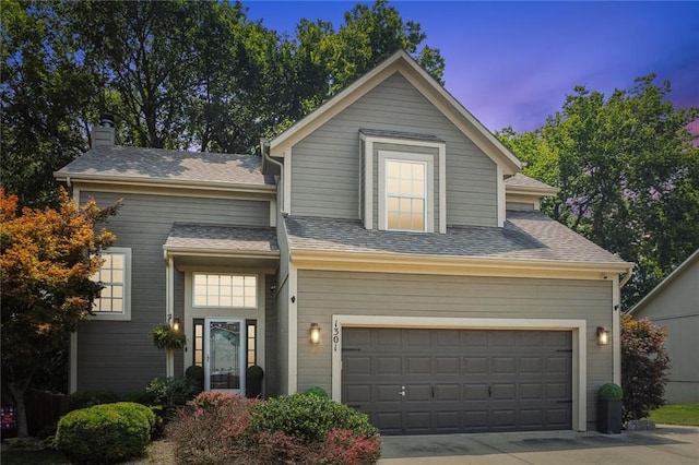 view of front of property featuring a garage