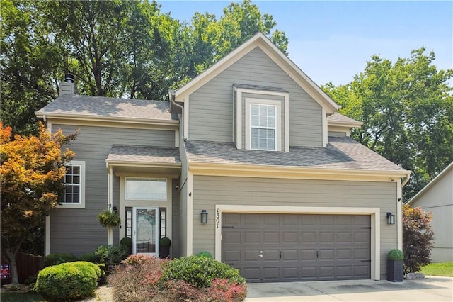 view of front of property with a garage