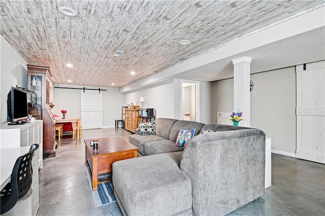 living area featuring finished concrete floors, recessed lighting, wood ceiling, and a barn door