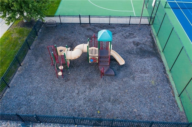 view of jungle gym featuring fence