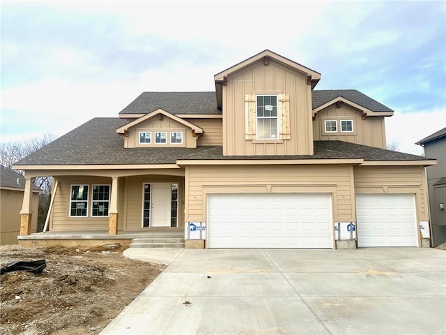 view of front of house with covered porch and a garage