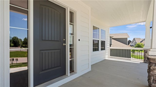 doorway to property featuring covered porch