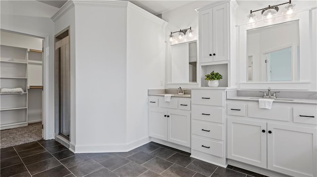 full bath featuring baseboards, tile patterned floors, a spacious closet, vanity, and a shower stall