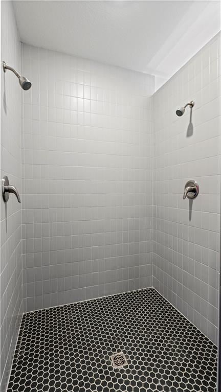 bathroom with tiled shower