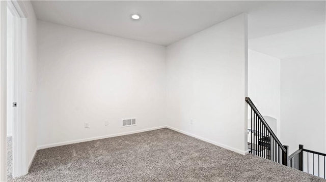 unfurnished room featuring recessed lighting, carpet, visible vents, and baseboards