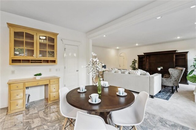 view of carpeted dining space