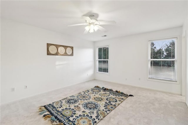 sitting room with carpet and ceiling fan