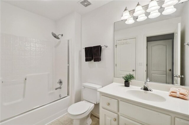 full bathroom featuring bathing tub / shower combination, tile patterned flooring, vanity, and toilet