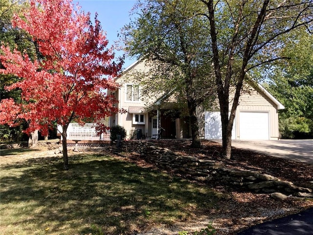 obstructed view of property with a front yard