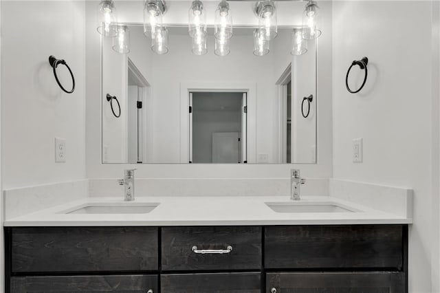 full bath with a sink and double vanity