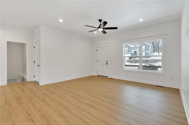 unfurnished living room featuring baseboards, light wood finished floors, a ceiling fan, and recessed lighting