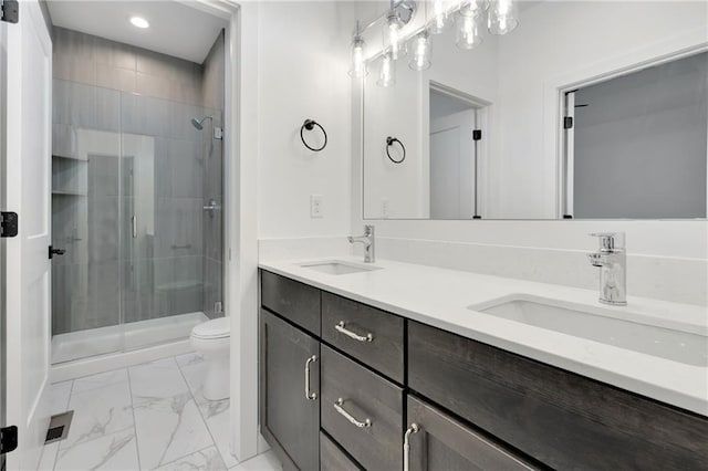 bathroom with marble finish floor, a sink, and a shower stall