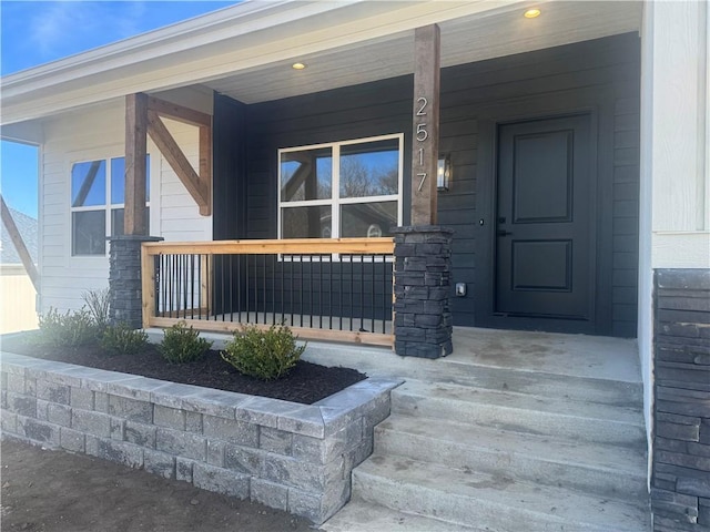 property entrance featuring covered porch