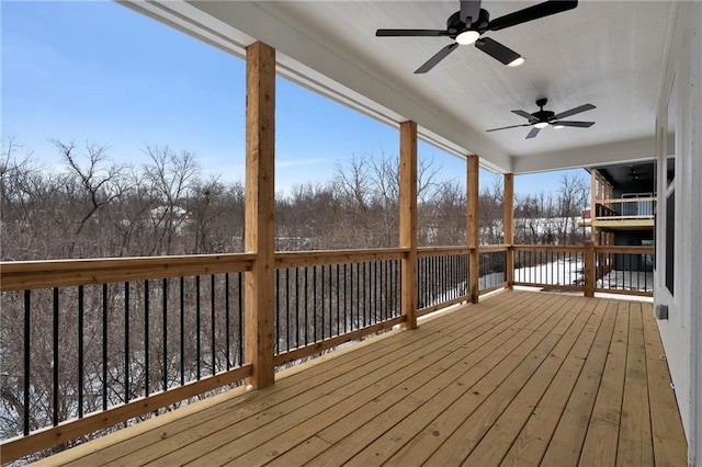 wooden deck with ceiling fan