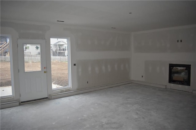 interior space featuring a healthy amount of sunlight and concrete flooring