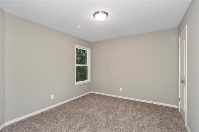 empty room with carpet flooring