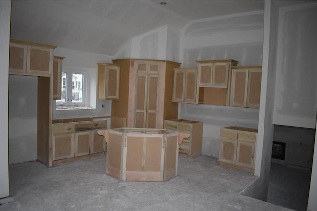 kitchen featuring a center island and vaulted ceiling