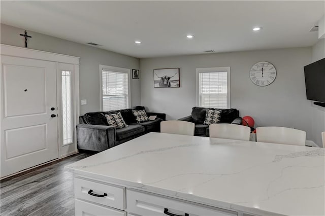 living room featuring light hardwood / wood-style flooring and plenty of natural light