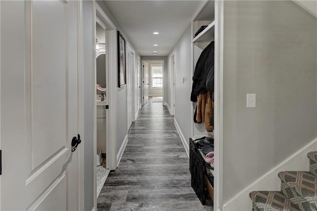 hallway with dark wood-type flooring