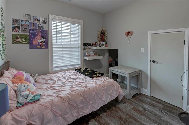 bedroom featuring dark wood-type flooring