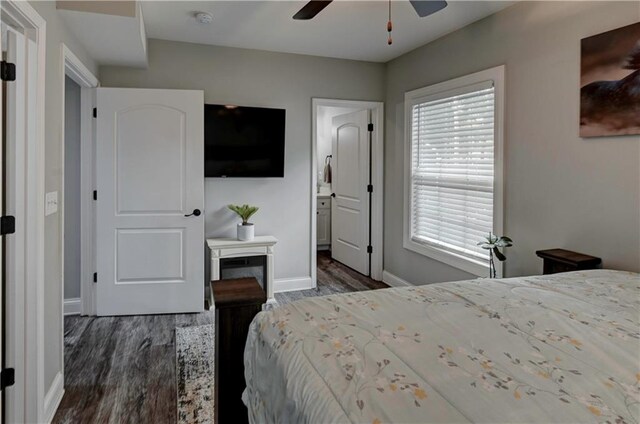 bedroom with ceiling fan and dark hardwood / wood-style floors