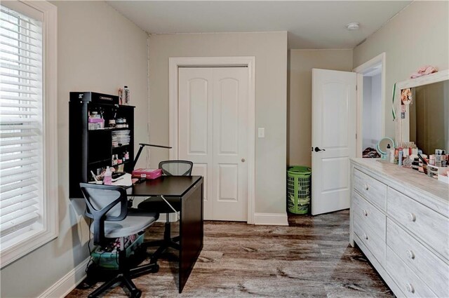 office with dark wood-type flooring