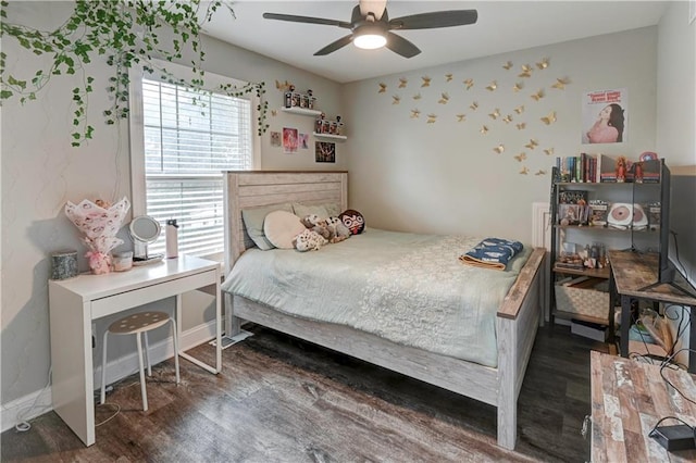 bedroom with ceiling fan and dark hardwood / wood-style floors