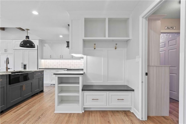 mudroom with light wood finished floors and recessed lighting