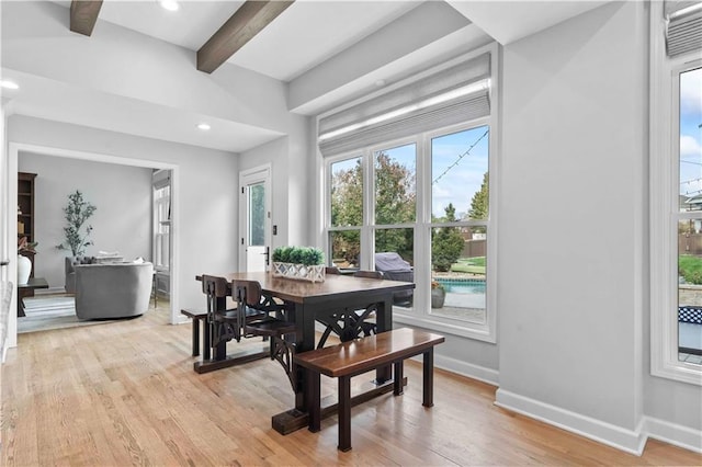 dining room featuring recessed lighting, beamed ceiling, light wood-type flooring, and baseboards