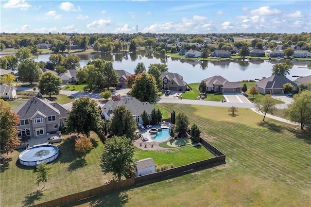 drone / aerial view featuring a water view and a residential view