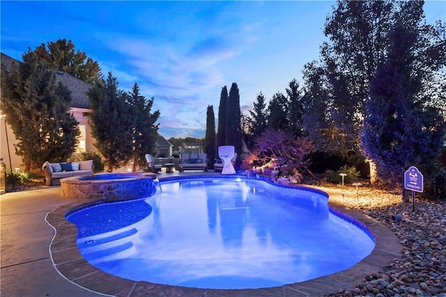 view of pool with a pool with connected hot tub and a patio