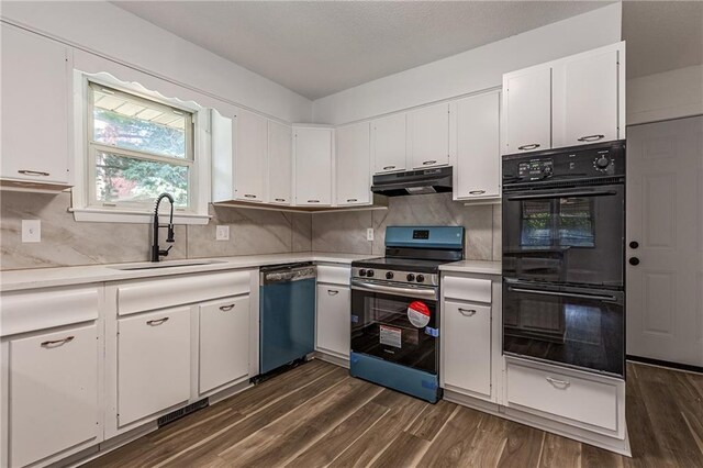 kitchen featuring dark hardwood / wood-style flooring, white cabinetry, appliances with stainless steel finishes, and sink