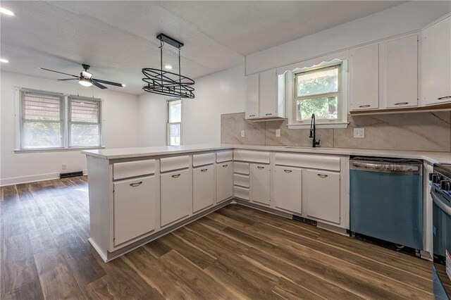 kitchen featuring white cabinetry, kitchen peninsula, hanging light fixtures, ceiling fan, and stainless steel dishwasher