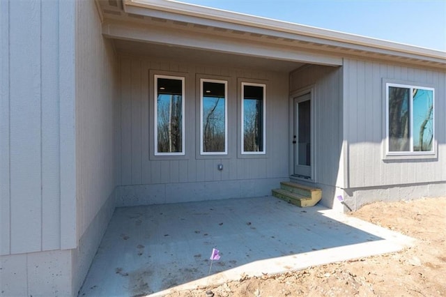 doorway to property with a patio