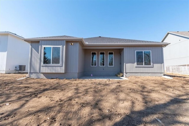 rear view of property with central AC and a patio area