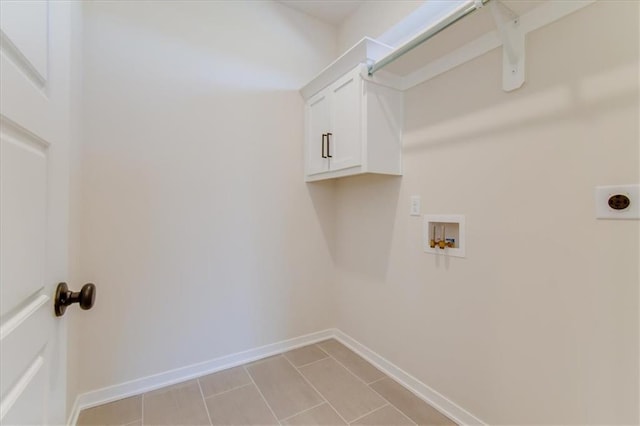 laundry area featuring cabinet space, baseboards, washer hookup, and electric dryer hookup