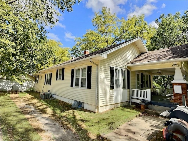 view of property exterior with central AC and covered porch