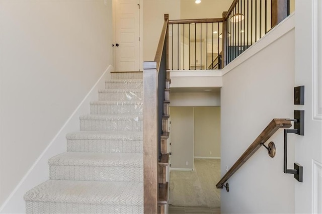 stairs featuring baseboards