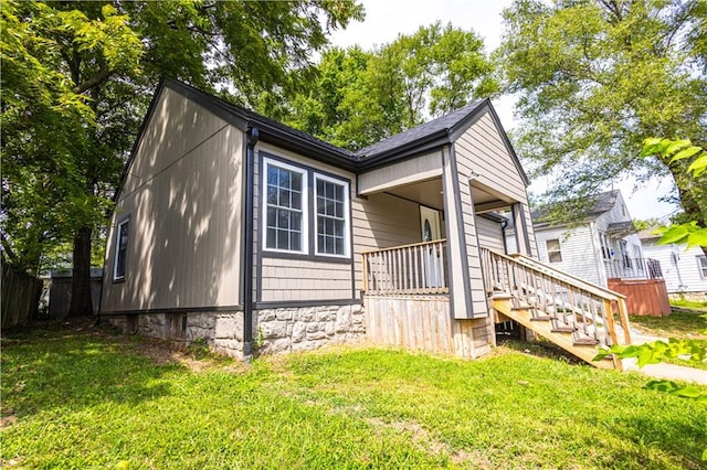 view of property exterior featuring a lawn