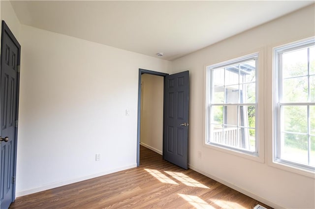 unfurnished room featuring light wood-type flooring