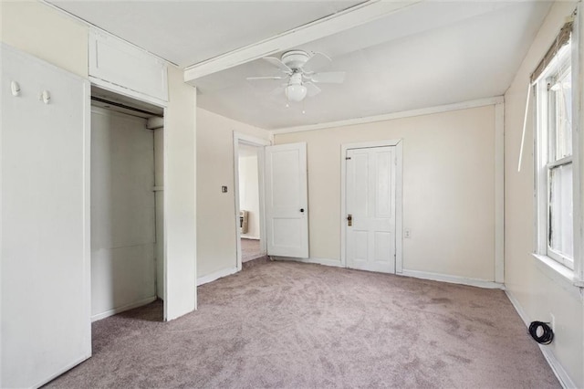 unfurnished bedroom featuring ceiling fan and light colored carpet