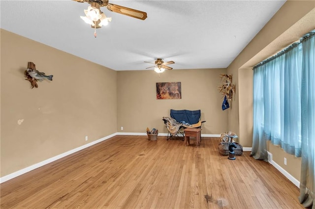 interior space with light hardwood / wood-style flooring and ceiling fan