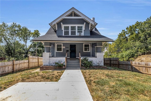 bungalow featuring a front yard and a porch