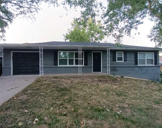 6914 Rowland Ave, Kansas City, KS 66109 - ranch-style house featuring brick siding, driveway, and an attached garage
