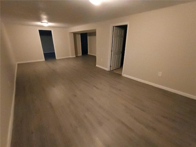 empty room with dark hardwood / wood-style floors